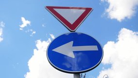 Yield and left turn traffic sign on the streets of Rome, Italy - Powered by Shutterstock - Get 15% off with code: PIKWIZARD15
