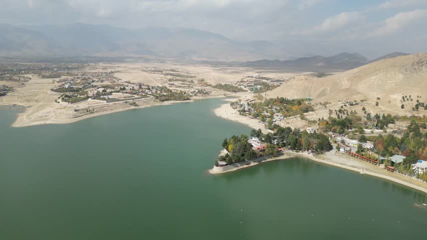 Aerial View of Qargha Water Reservoir, Afghanistan. Lake and Lakefront Buildings, Drone Shot
