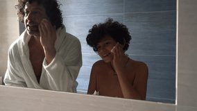 Father and 11-year-old teenage son play shaving with shaving foam and razor in the morning in the bathroom at home - father and son relationship and teaching the child the rules of personal hygiene - Powered by Shutterstock - Get 15% off with code: PIKWIZARD15