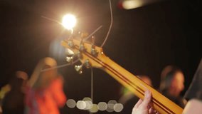 A Bassist Plays On Stage With The Band Blurred In The Background. A Closeup Of A Bass Guitar Neck During A Live Night Performance. - Powered by Shutterstock - Get 15% off with code: PIKWIZARD15