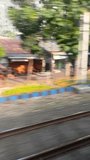 Footage of green landscape seen through a train window while moving, showing motion blur and natural scenery along the railway journey - Powered by Shutterstock - Get 15% off with code: PIKWIZARD15