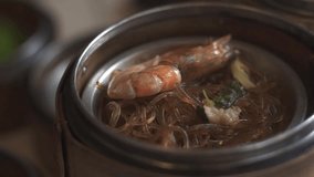 A close-up shot of various dim sum dishes served in traditional bamboo steamers at Dim Sum restaurant. Cinematic lighting. Delicious dim sum, Chinese food. - Powered by Shutterstock - Get 15% off with code: PIKWIZARD15