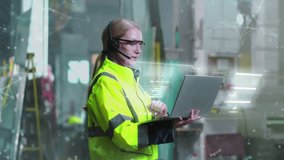 Caucasian female engineer in reflective jacket and headset using laptop in industrial workspace. Holographic interface with data visuals floating around. Concept of smart industry technology. - Powered by Shutterstock - Get 15% off with code: PIKWIZARD15