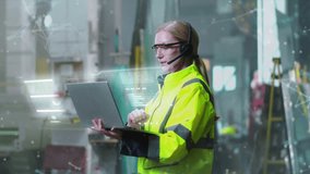 Female engineer in reflective safety jacket using laptop and wearing headset in modern industrial workspace. Transparent holographic data panels floating around. Concept of manufacturing technology. - Powered by Shutterstock - Get 15% off with code: PIKWIZARD15