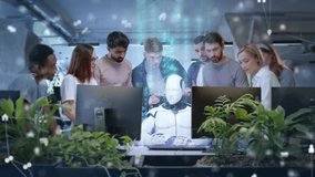 Group of diverse office workers standing around humanoid robot at desk with holographic code above. Team smiling and clapping celebrating artificial intelligence success in modern workspace. - Powered by Shutterstock - Get 15% off with code: PIKWIZARD15