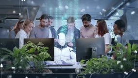 Diverse team of employees gathering around humanoid robot sitting at computer with glowing holographic data above. Colleagues smiling and applauding new AI innovation in modern tech office. - Powered by Shutterstock - Get 15% off with code: PIKWIZARD15