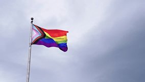 LGBT community. Tolerance and equality. World gay pride. Rainbow gay flag. Pride month. LGBTQ rainbow flag. LGBT rainbow flag waving against sky. Symbol of pride and LGBTQ. Colorful pride flag - Powered by Shutterstock - Get 15% off with code: PIKWIZARD15