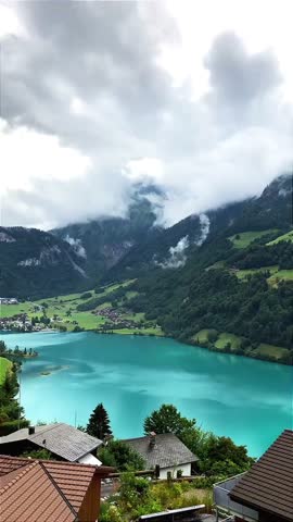 Beautiful Alpine Landscape with Blue Lake and Green Hills