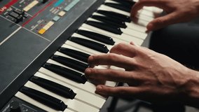 Playing piano vintage retro synthesizer. Close up of man hands playing jazz on the piano. Fingers on the piano, vintage colors. A very close look at a jazz pianist hands. Man playing the piano, close - Powered by Shutterstock - Get 15% off with code: PIKWIZARD15