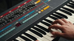 Playing piano vintage retro synthesizer. Close up of man hands playing jazz on the piano. Fingers on the piano, vintage colors. A very close look at a jazz pianist hands. Man playing the piano, close - Powered by Shutterstock - Get 15% off with code: PIKWIZARD15