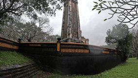 Tu Duc tomb site, Hue. The Triple Gate (Tam Quan), a two-tiered, ornate structure with arches and elaborate ceramic detailing  - Powered by Shutterstock - Get 15% off with code: PIKWIZARD15