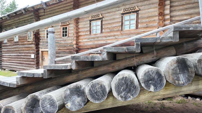 An old log house in a Russian village. Slowmotion