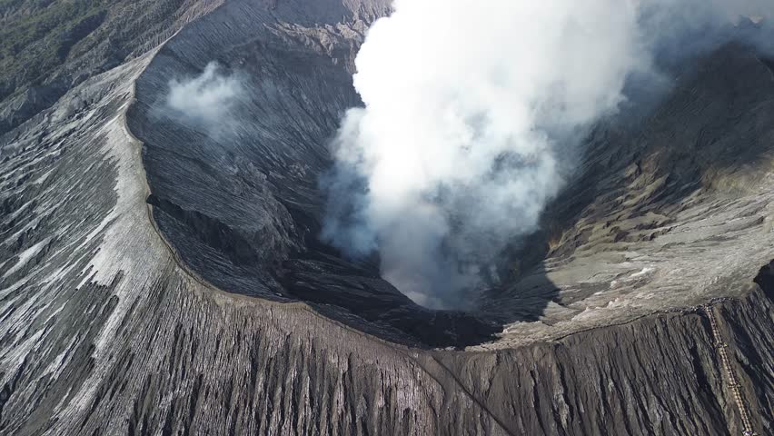 Volcano crater geothermal activity sulfur steam cloud Mount Bromo Java island Indonesia