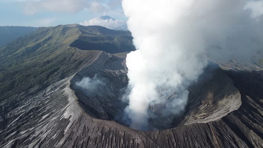 Volcano crater geothermal activity sulfur steam cloud Mount Bromo Java island Indonesia