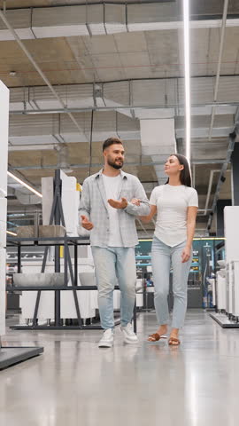 Young couple choosing bathroom fixtures in a hardware store