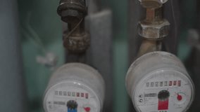 Water consumption meter. Close-up of the water usage counter. Household water usage. - Powered by Shutterstock - Get 15% off with code: PIKWIZARD15