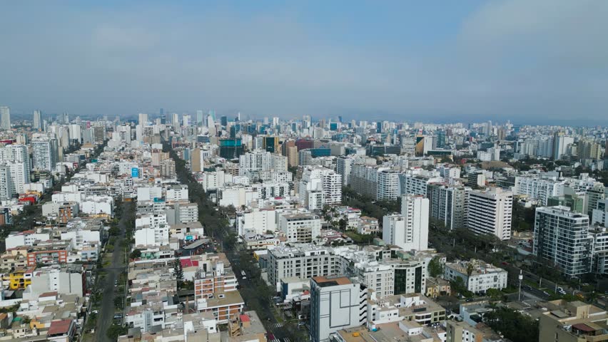 Sunny afternoon drone footage over the San Isidro financial district in Lima, Peru.