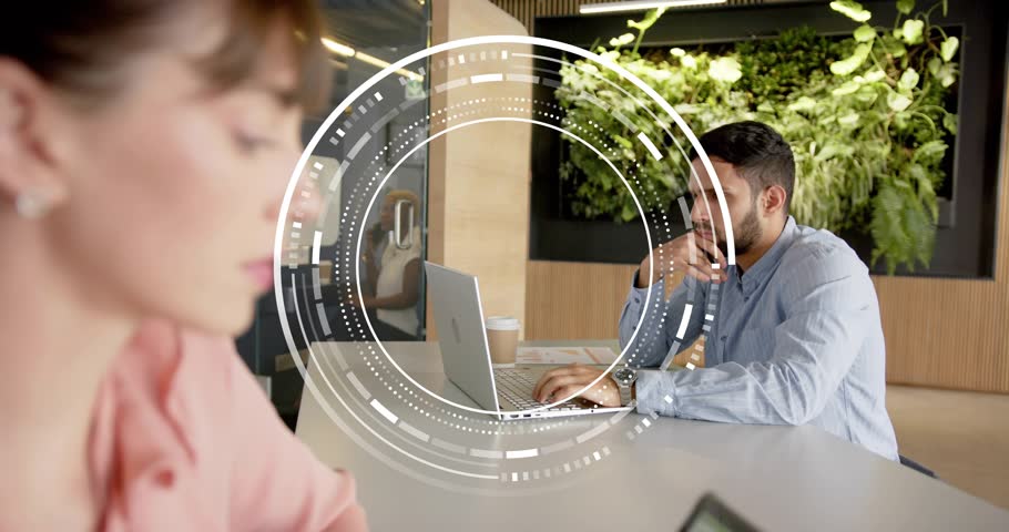 Woman tapping tablet initiating HUD as man sipping coffee, typing and analyzing business data. Collaboration, productivity, digital, innovation, modern, workspace, communication