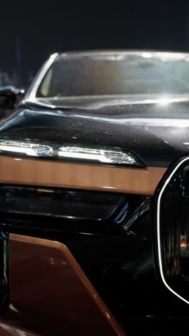The front design of this sleek luxury car features modern elements and cuttingedge technology