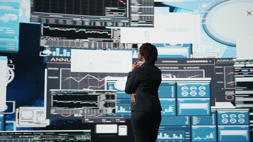 Management executive comparing company metrics on digital videowall before making decisions. Entrepreneur analyzing key performance indicators to optimize startup profitability, camera A