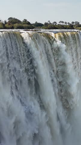 Famous Falls At Victoria Falls In Matabeleland North Zimbabwe. Giant Waterfalls. Nature Landscape. Victoria Falls At Matabeleland North Zimbabwe. Zambezi River. Travel Scenery.
