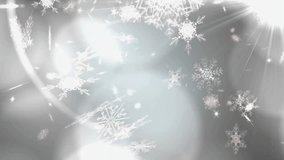 With starburst flare pulsing, white snowflakes drifting downward over grey bokeh evoking winter. Winter, serenity, glow, elegance, atmosphere, motion, tranquility - Powered by Shutterstock - Get 15% off with code: PIKWIZARD15