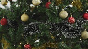 Snowfall starting camera panning downward, Xmas tree branches swaying showcasing ornaments. Festive, decor, shimmer, illumination, celebration, winter, elegance - Powered by Shutterstock - Get 15% off with code: PIKWIZARD15