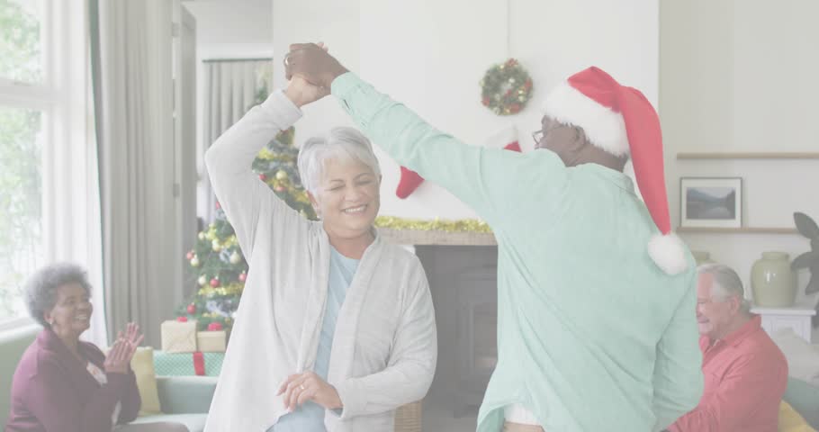Senior man lifting partner into twirl by Christmas tree amid claps under glitch code for Christmas. Festive, celebration, companionship, warmth, holiday, elegance, merriment