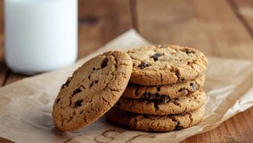 Homemade stack of chocolate chip cookies on a wooden table for a sweet dessert or breakfast snack - Powered by Shutterstock - Get 15% off with code: PIKWIZARD15