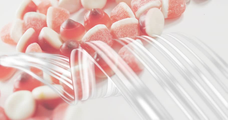 At 1s reflective silver ribbons undulating over red-white gummy candies revealing textures. Sweets, confectionery, abstract, shiny, luxury, playful, minimalistic