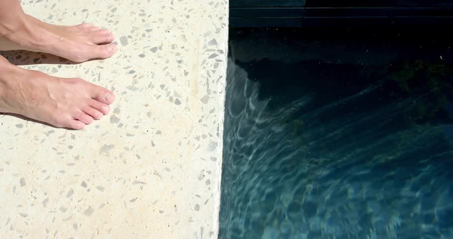 Woman shifting on pool deck causing turquoise math diagrams overlaying water educating designers. Geometric, analytical, mathematical, educational, minimalist, vibrant, conceptual