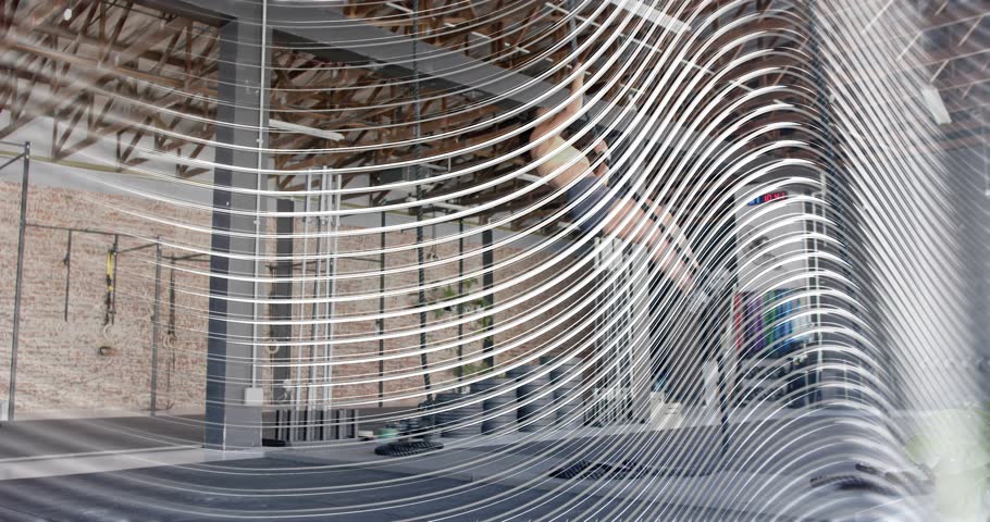 Woman shifting weight into pillar, executing handstand for fitness with animated metrics rising. Exercise, balance, strength, fitness, urban, modern, workout