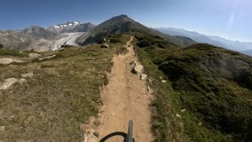  POV of mountain biker riding a dangerous singletrack trail in the Swiss alps - Powered by Shutterstock - Get 15% off with code: PIKWIZARD15