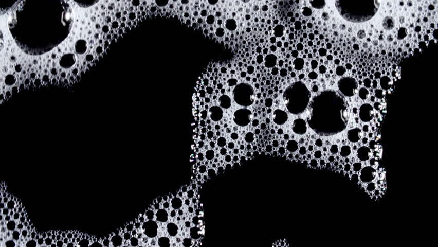 Texture of white soap foam with bubbles abstract background. Soap sud macro structure. Bathtup Soap Foam. Natural White Shampoo Bubbles Motion.