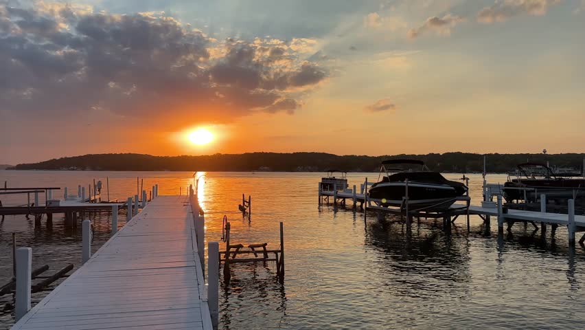 Sunset over Lake Geneva, Wisconsin with docks and boats visible