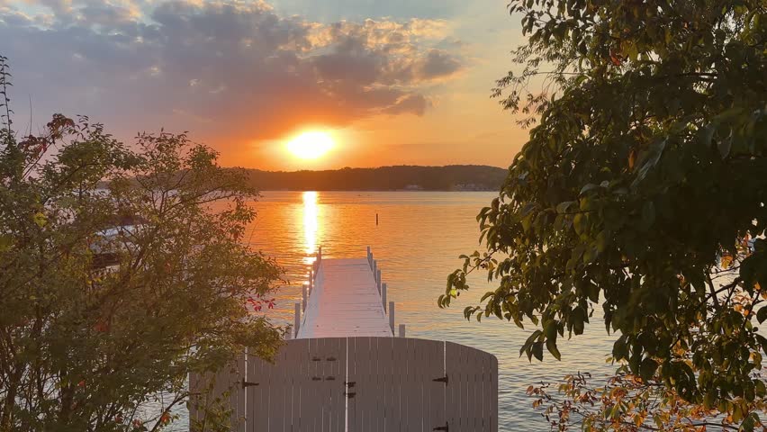 Sunset over Lake Geneva viewed from a dock, evoking peace and serenity