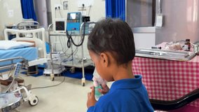 child patient inhaling medicine through a face mask for breathing for respiratory therapy - Powered by Shutterstock - Get 15% off with code: PIKWIZARD15
