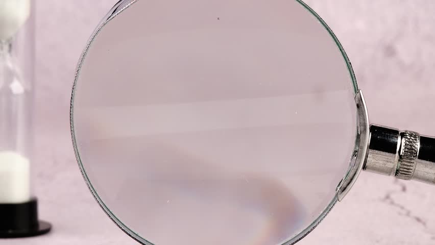 Watch as a magnifying glass reveals the words FUTURE CEO 2026, hinting at career aspirations. Books, a calculator, and an hourglass rest nearby, emphasizing the passage of time