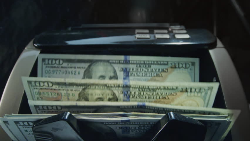 Money cash counting equipment machine. Slow motion. Bank automatic for paper buck. Credit or loan