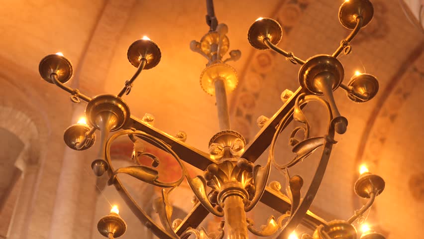 Closeup view of chandelier inside Basilica of Saint-Sernin in Toulouse, France.