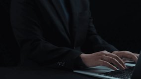 A professional person is using a laptop with a futuristic cloud computing graphic above, showcasing icons for data transfer and security in a modern workspace. Qubit - Powered by Shutterstock - Get 15% off with code: PIKWIZARD15