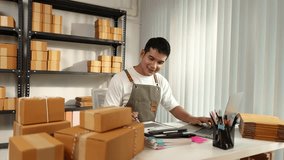 An online store owner preparing product packages for delivery, representing the growing e-commerce trend, small business management, and efficiency in online retail logistics. - Powered by Shutterstock - Get 15% off with code: PIKWIZARD15