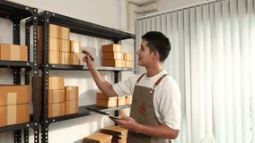 An online store owner preparing product packages for delivery, representing the growing e-commerce trend, small business management, and efficiency in online retail logistics. - Powered by Shutterstock - Get 15% off with code: PIKWIZARD15