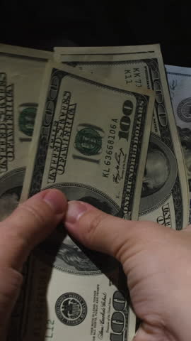 Cash money. Hands counting dollar bills