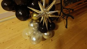 Festive black gold and silver balloons with shiny star showing elegant design - Powered by Shutterstock - Get 15% off with code: PIKWIZARD15