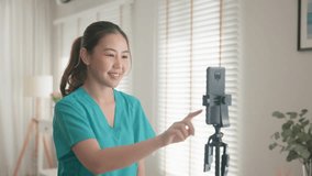 Young adult woman asia Gen Z people anti aging expert modern nurse live talk prepare video selfie camera on mobile phone app mental health care Online side hustle digital virtual asian vlogger filming - Powered by Shutterstock - Get 15% off with code: PIKWIZARD15