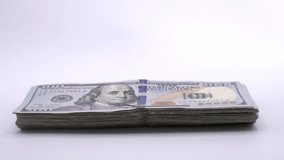 Person placing a wad of hundred-dollar bills. Slow motion close up - Powered by Shutterstock - Get 15% off with code: PIKWIZARD15
