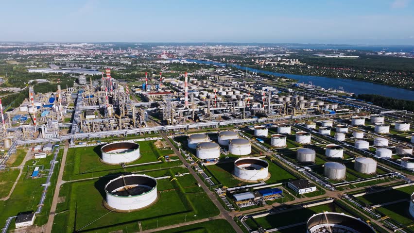 Large oil refinery with fuel storage tanks, industrial facilities in Europe