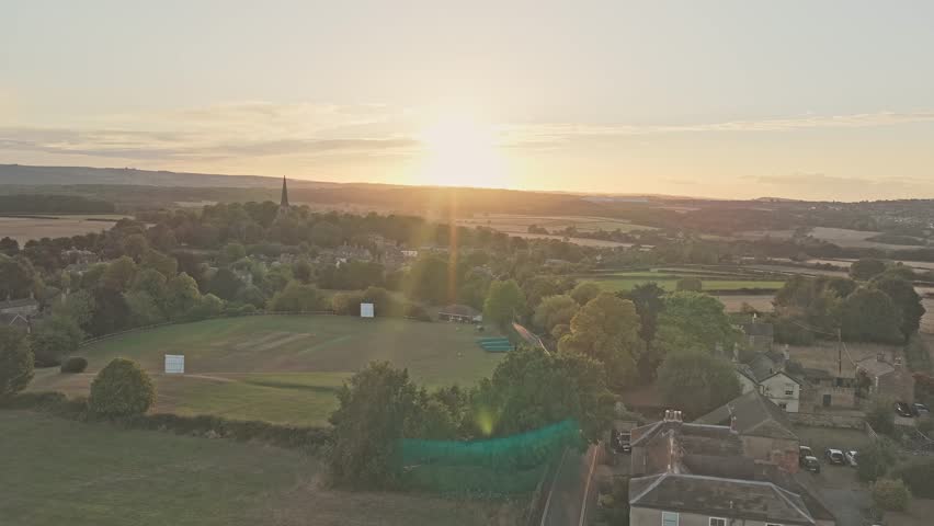 Wentworth’s Gothic bell tower og the Old Holy Trinity Church in Wentworth, South Yorkshire, England rises above the village, in golden light across South Yorkshire’s countryside.