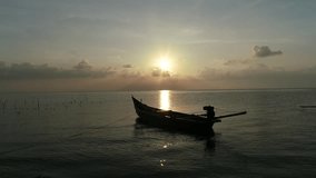 Aerial 4K footage of sunrise over the calm sea with fishing boats and golden reflections on the water - Powered by Shutterstock - Get 15% off with code: PIKWIZARD15